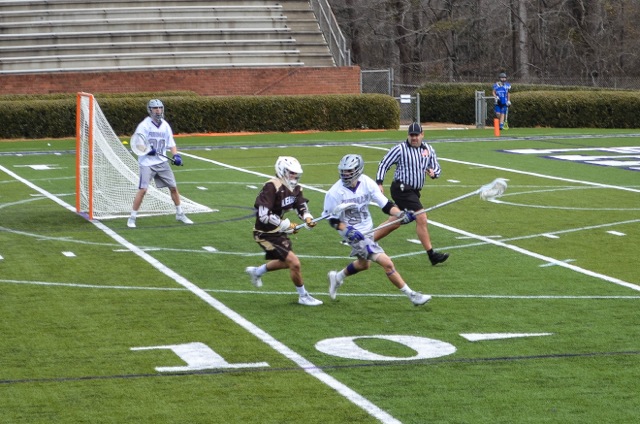 Freshman defenseman Tommy Farnish (#57) protects the ball behind Fur-man’s own goal in the first-ever Furman lacrosse game. Despite falling 13-6 to Lehigh, the team looks like they have solid foundation from which to build upon Photo courtesy of Laura Krueger