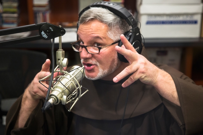 Father Patrick Tuttle’s show “Tell Me Something Good” is the most listened to show on WPLS radio Photo courtesy of Dante Durrman