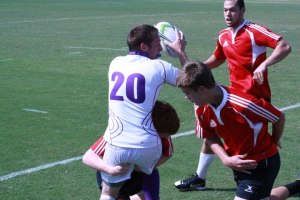 Sammy Hobgood stretching the ball out while trying to avoid a tackling defender. Photo courtesy of Sammyy Hobgood