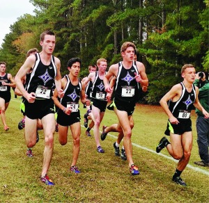 The Furman men’s cross country team runs in tight formation at the SoCon Championships. Photo courtesy of Marian Baker