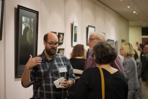 Undergraduate evening students were present at the opening of the photography exhibit to showcase and discuss their work and the techniques they employed.